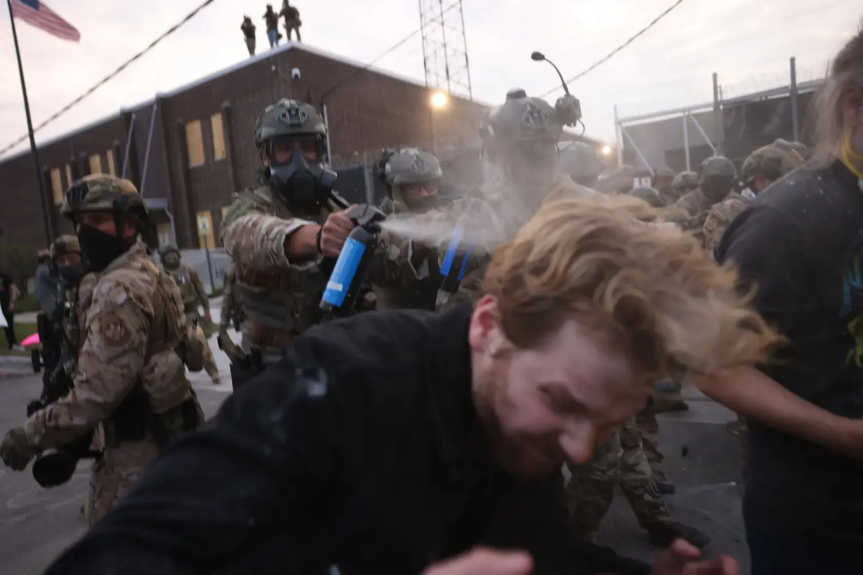 Original caption: “The Rev. David Black of First Presbyterian Church recoils as U.S. Customs and Border agents deploy tear gas and pepper balls Friday at the Broadview ICE facility outside Chicago. Ashlee Rezin/Sun-Times.” Original caption: “The Rev. David Black of First Presbyterian Church recoils as U.S. Customs and Border agents deploy tear gas and pepper balls Friday at the Broadview ICE facility outside Chicago. Ashlee Rezin/Sun-Times.”