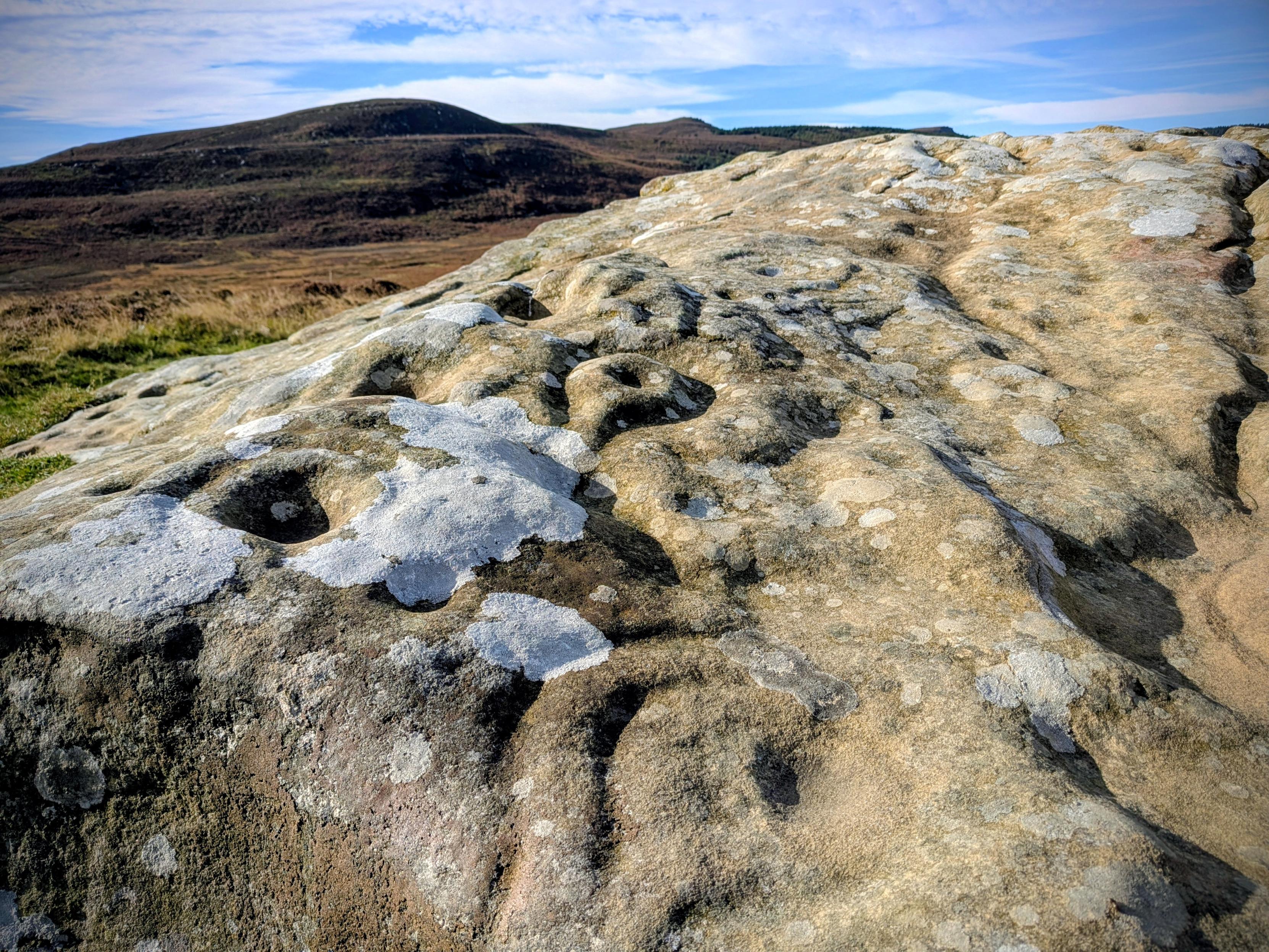 Cup and ring marks on a stone at Lordenshaw, Northumberland