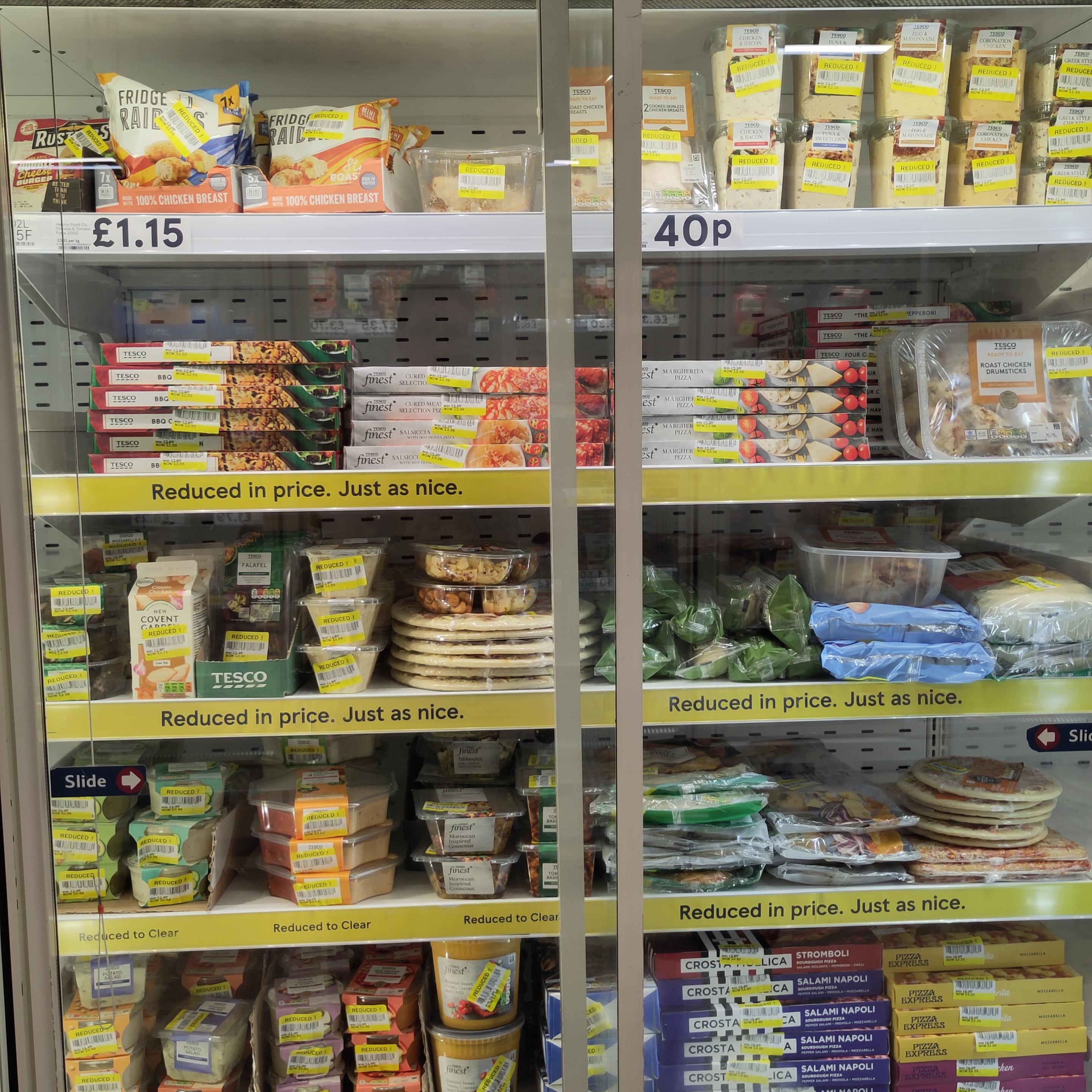 A chiller cabinet where everything has a yellow price reduction sticker on it